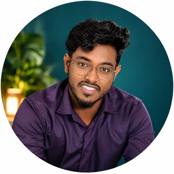 Sowndarrajan, founder of SRT Digital Solutions, smiling in a purple shirt with glasses